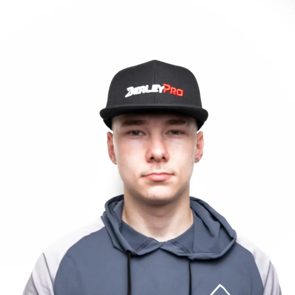 Angler wearing a black BerleyPro snapback cap