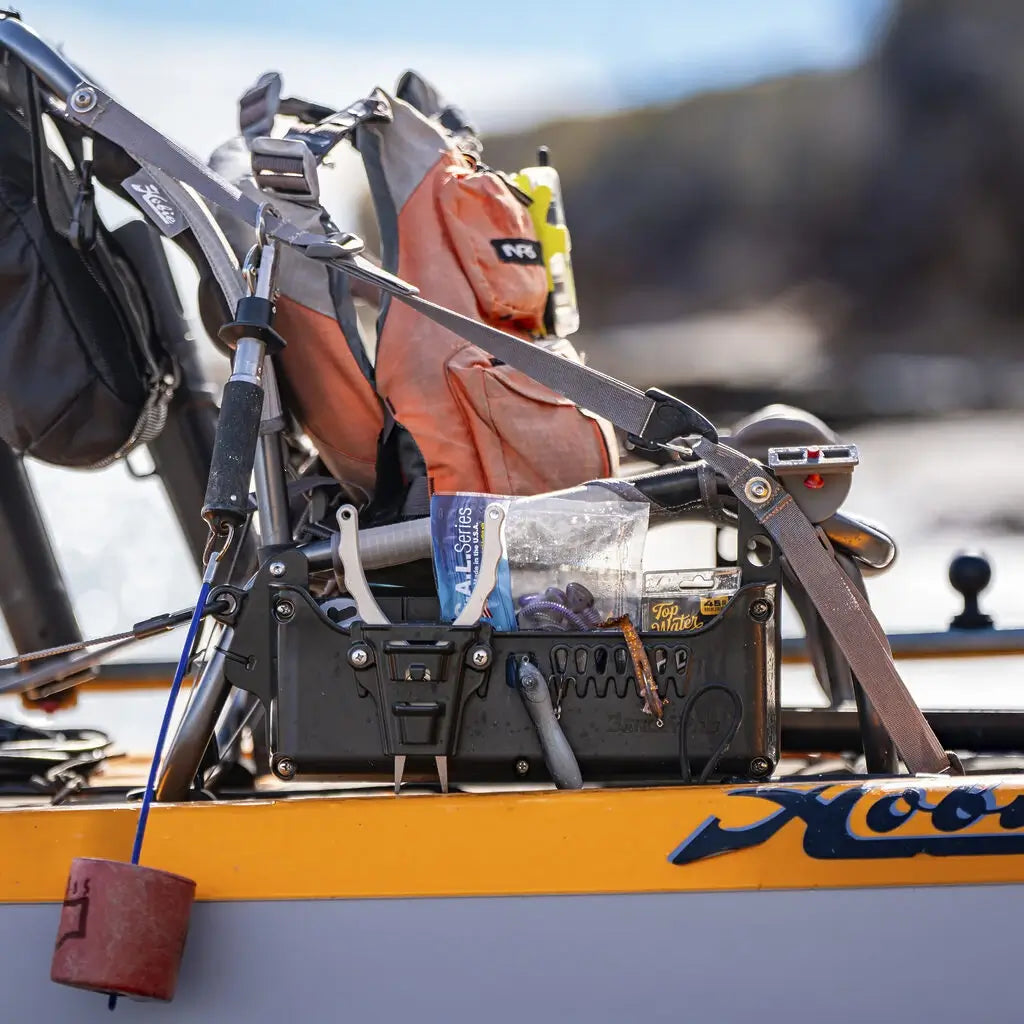 Hobie Lynx kayak on the water with the loaded Side Bro caddy beside the seat