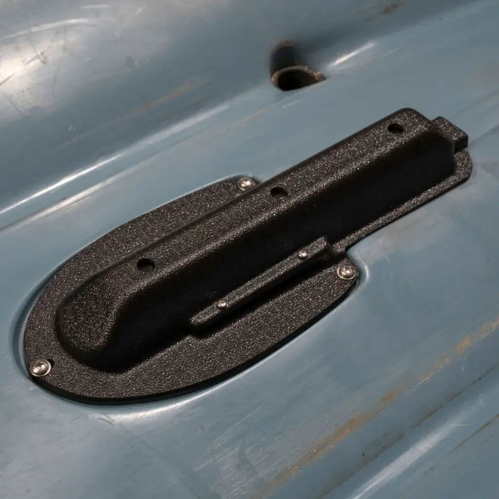 Textured Lowrance Eagle transducer mount screwed into a Hobie Compass kayak hull
