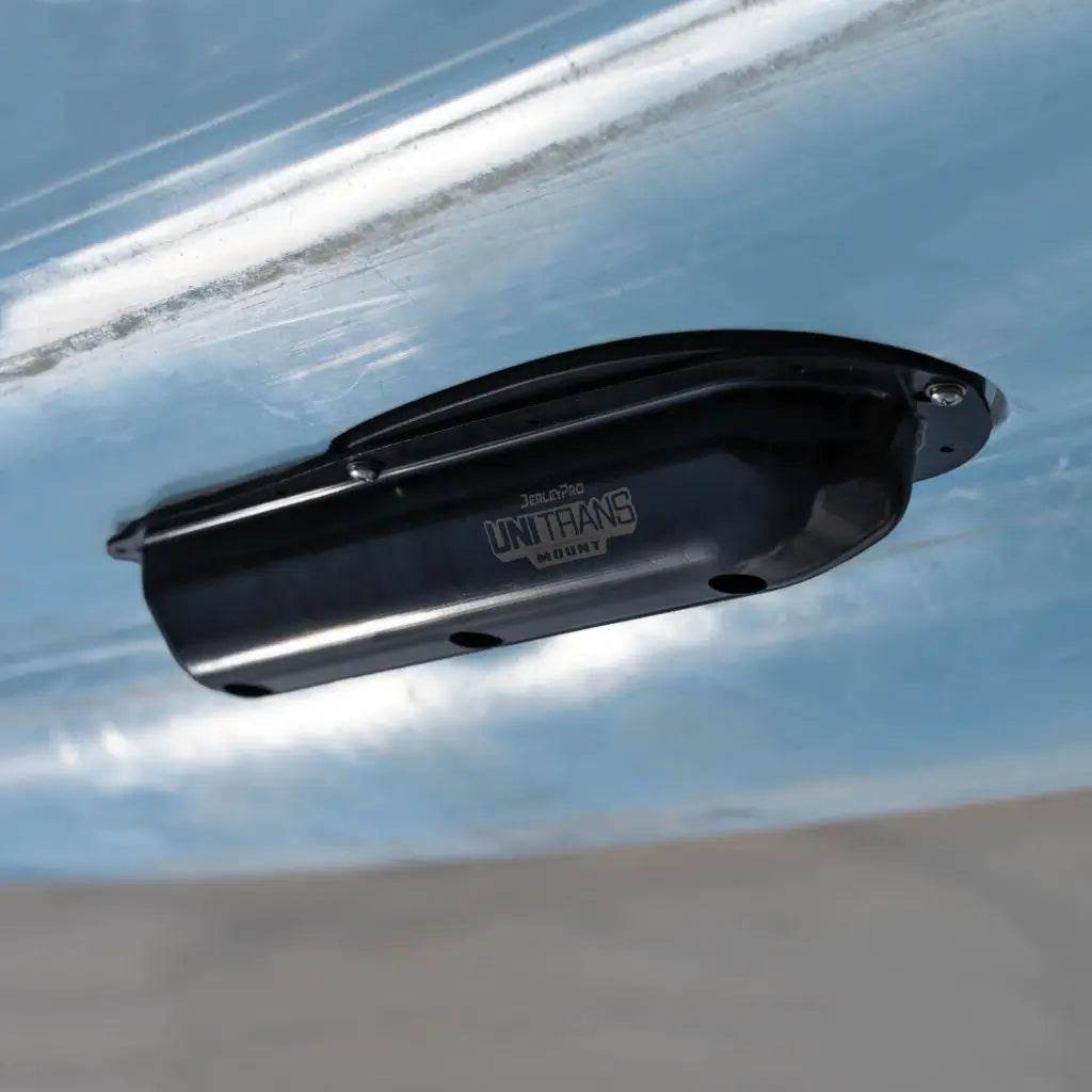 BerleyPro UNI TRANS transducer cover fitted to the hull of a slate blue Hobie kayak