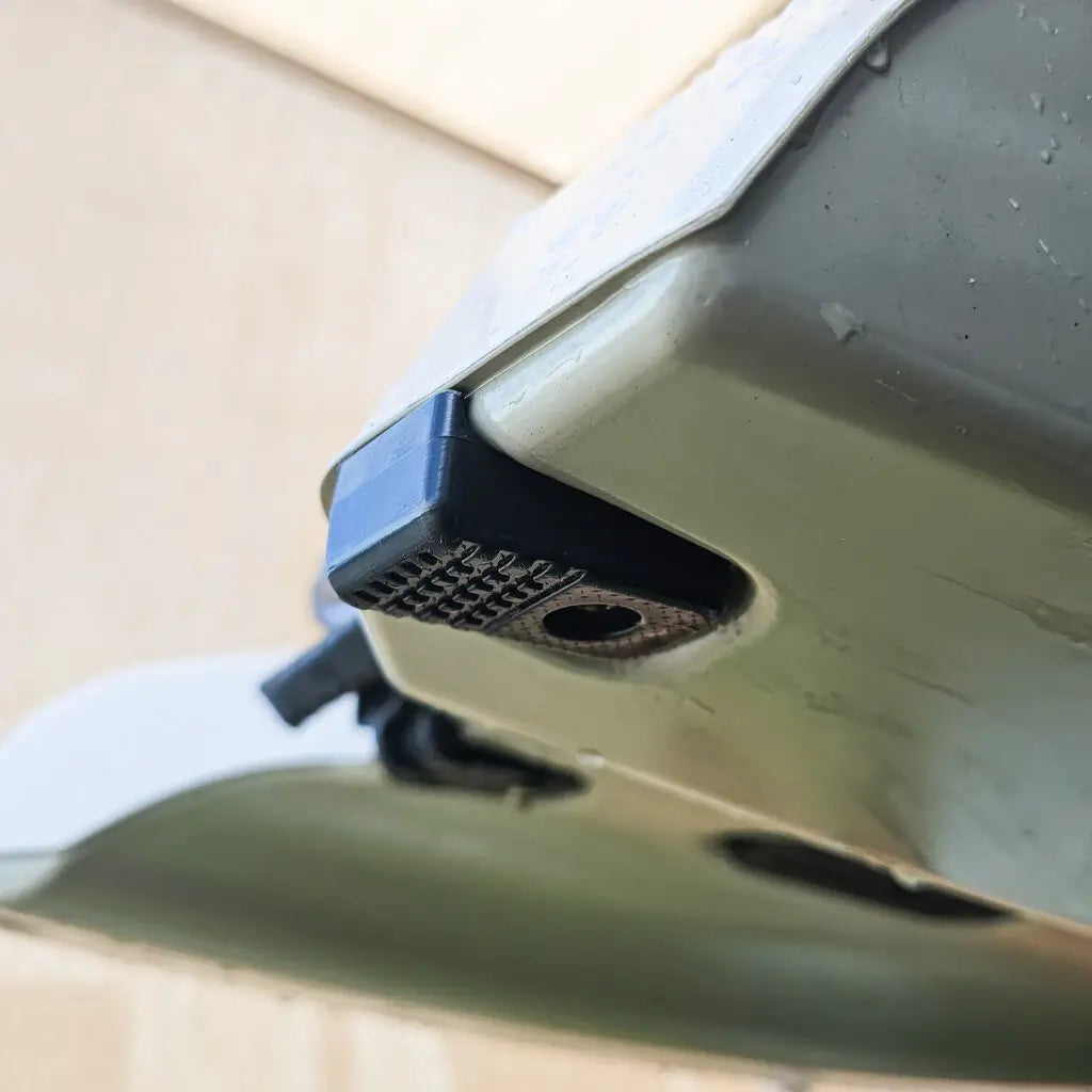 Upgraded skid plate fitted to the underside of an olive Hobie Lynx hull