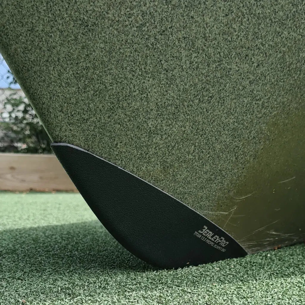 Bumper Bro fitted to the bow of an olive Native Titan Propel 13.5 standing on turf