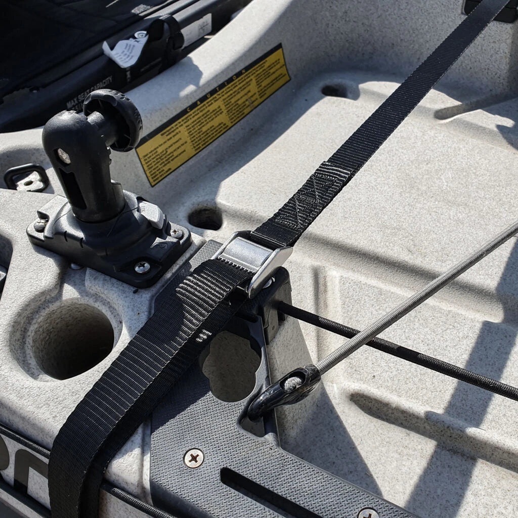 Stainless cam buckle tensioning the Kimmi Cart kayak trolley strap over a grey kayak deck