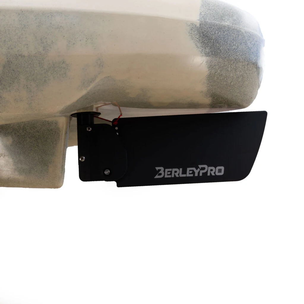 Wider black rudder blade fitted beneath the stern of a khaki Native kayak
