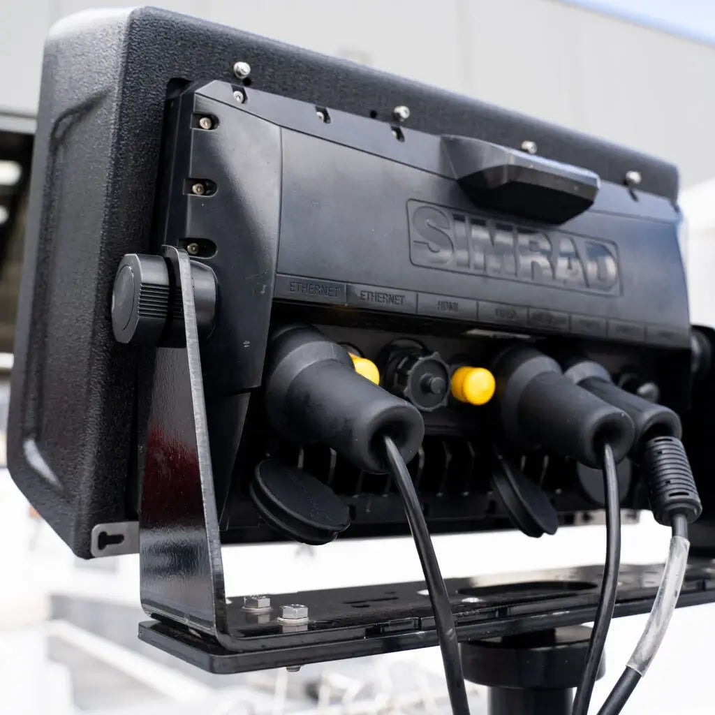 Rear of a mounted Simrad display with Connector Protectors over the power and transducer plugs