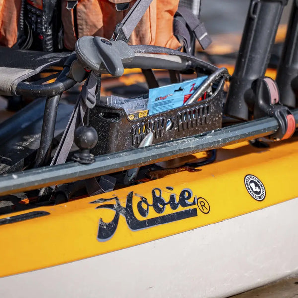 Side Bro caddy full of tackle mounted on to the seat of a Hobie Lynx fishing kayak