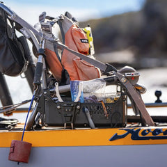 Hobie Lynx kayak on the water with the loaded Side Bro caddy beside the seat