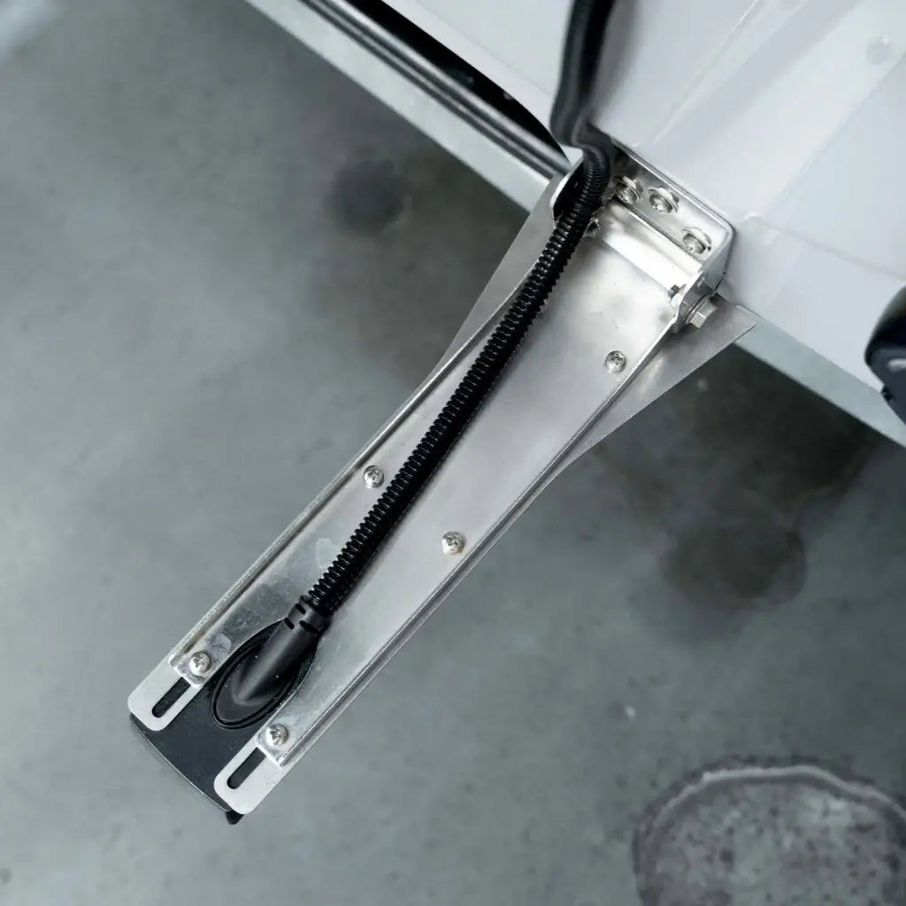 Rooster Rooter deflector fitted along a Lowrance HD transducer bracket on a transom