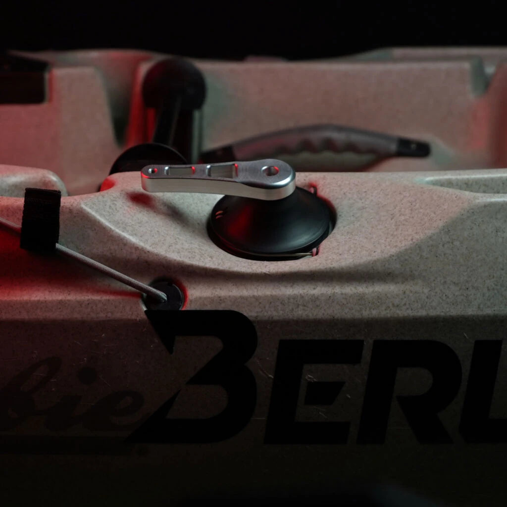 Raised aluminium steering handle installed on the deck of a red Hobie Outback kayak