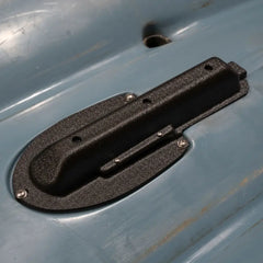 Textured Lowrance Eagle transducer mount screwed into a Hobie Compass kayak hull