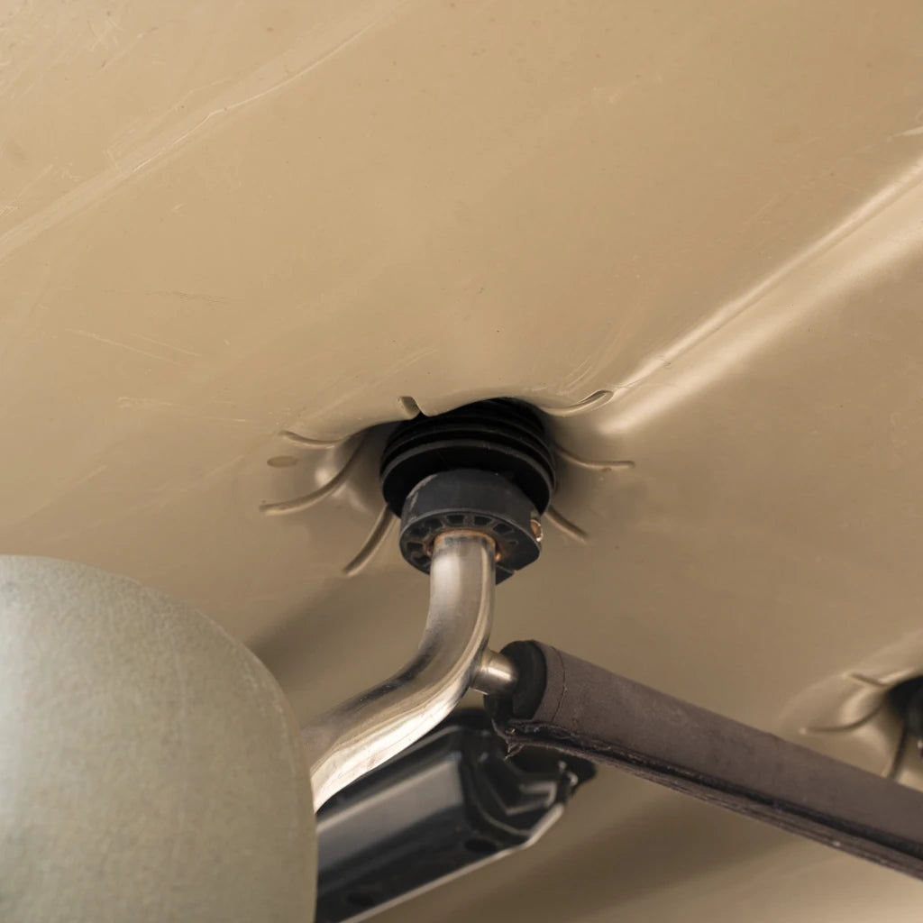 Scupper Bro seated in a Hobie Lynx scupper hole with the cart post passing through it