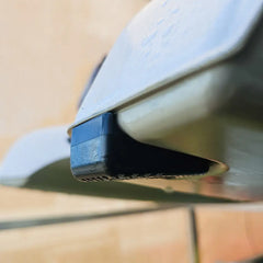 Close-up of a black skid plate fitted to a Hobie Lynx kayak stern