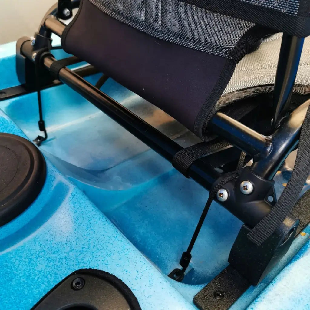Rear seat riser installed under the seat leg on a blue speckled Native Slayer kayak deck