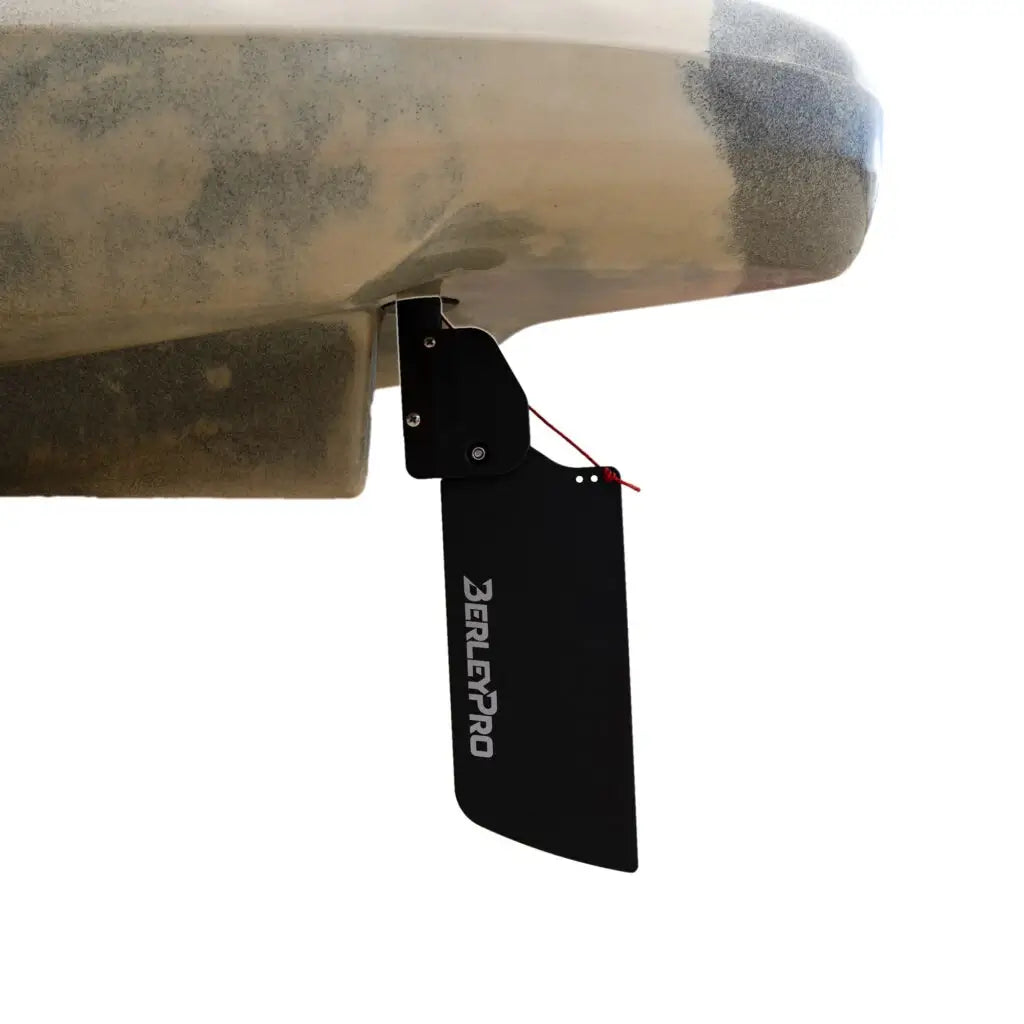 Upgraded black rudder blade fitted under the stern of a khaki Native kayak