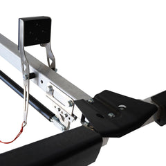 Close-up of the Will-I kayak loader arm, black cradle pad and red release cord on a roof rack