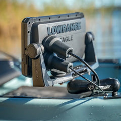 Lowrance Eagle on a kayak by the water with a Connector Protector on the plug behind it