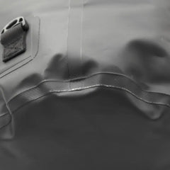 Extreme close-up of the welded seam and base construction of the black dry bag