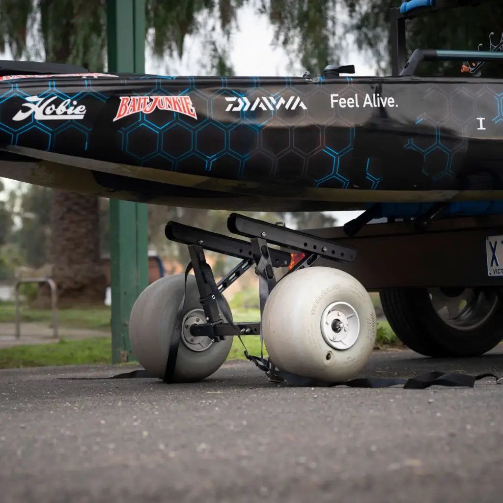 Kimmi Cart kayak trolley carrying a blue camo Hobie Pro Angler 14 fishing kayak