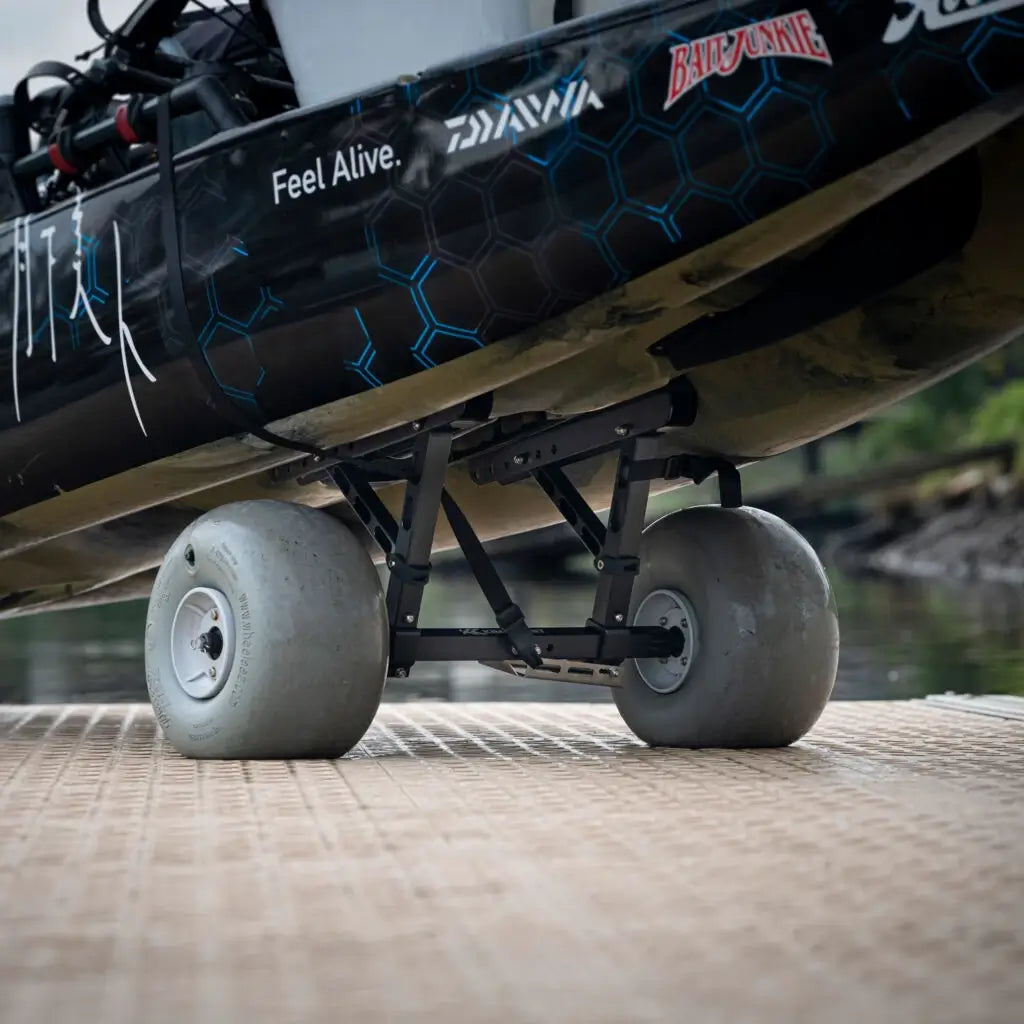 Blue camo Hobie Pro Angler 14 on the Kimmi Cart kayak trolley, viewed from the stern on a ramp