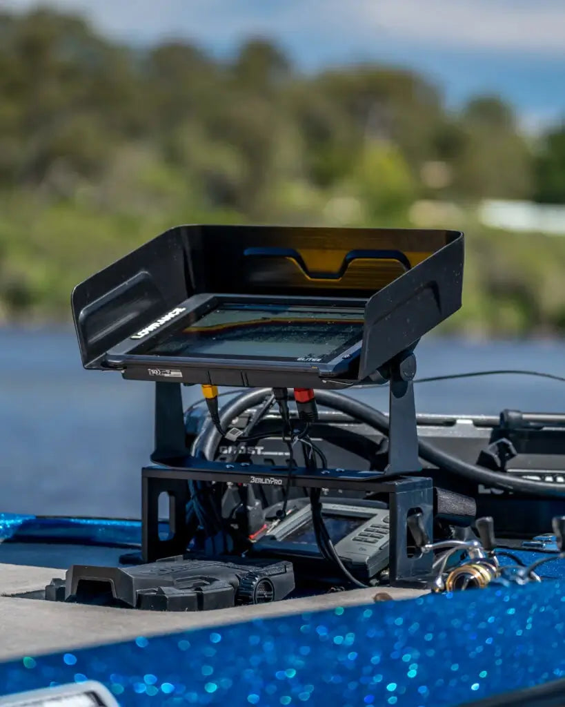 Lowrance Carbon 16 under a BerleyPro visor mounted on a blue kayak deck outdoors