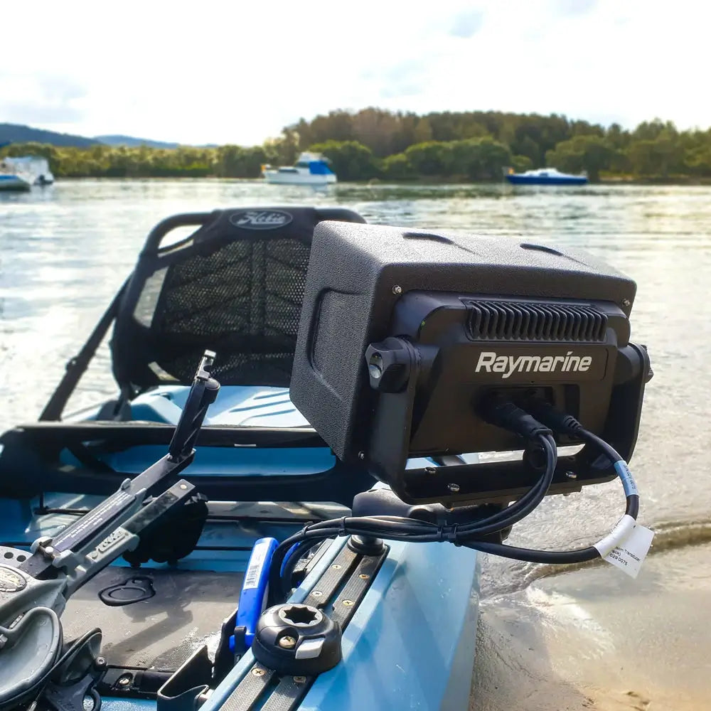 Raymarine Element under a BerleyPro visor mounted on a blue kayak, lake behind