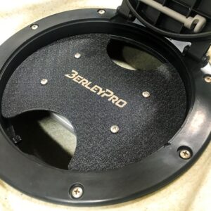 Check out the BerleyPro Batterang Bro! This sleek black circular hatch cover proudly flaunts the "BerleyPro" name, surrounded by precisely placed screws. It’s not just a cover—it’s a testament to top-notch craftsmanship and design excellence you’d expect from us at BerleyPro.