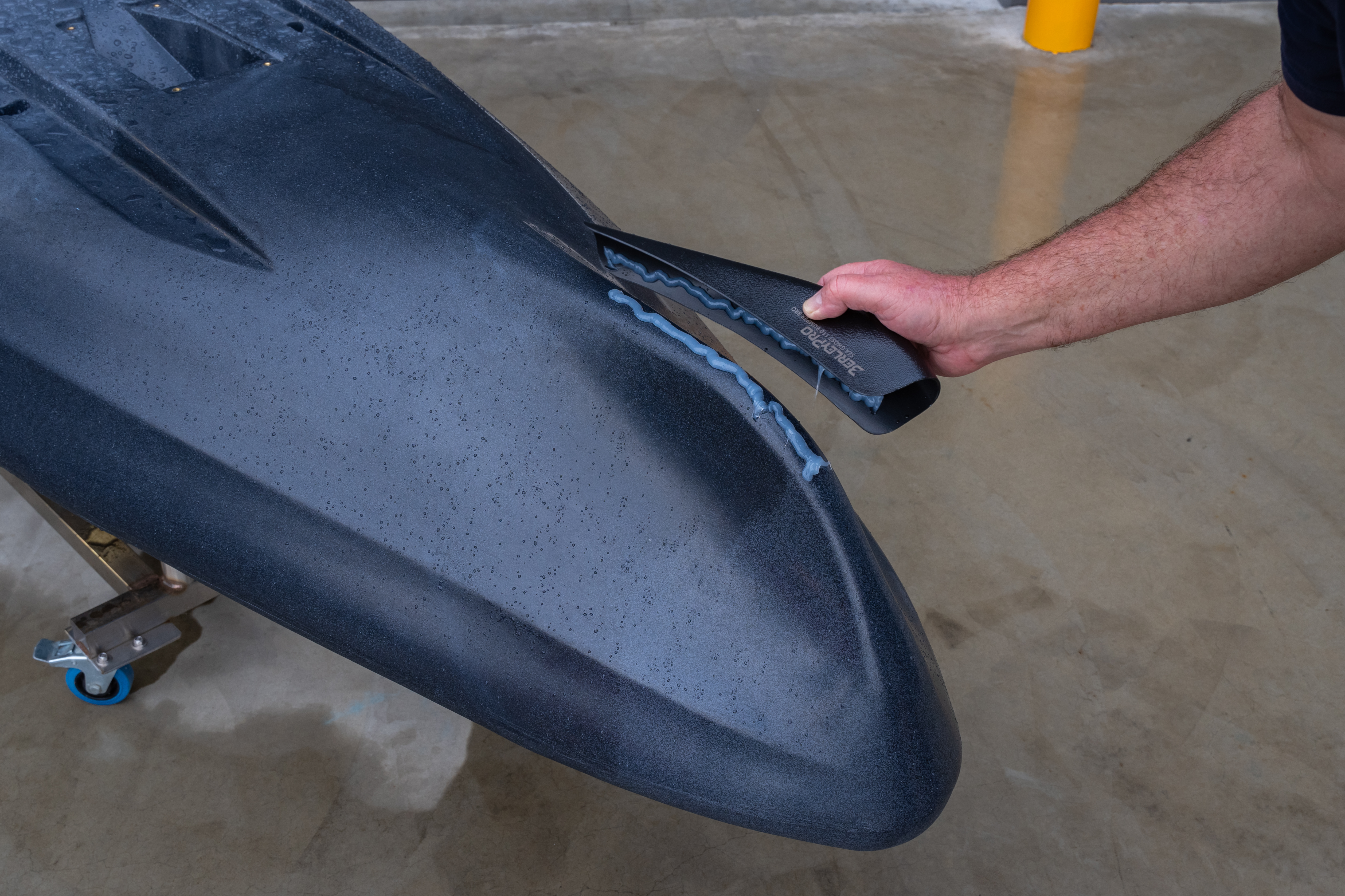 Apply a bead of marine adhesive along the centerline of the keel