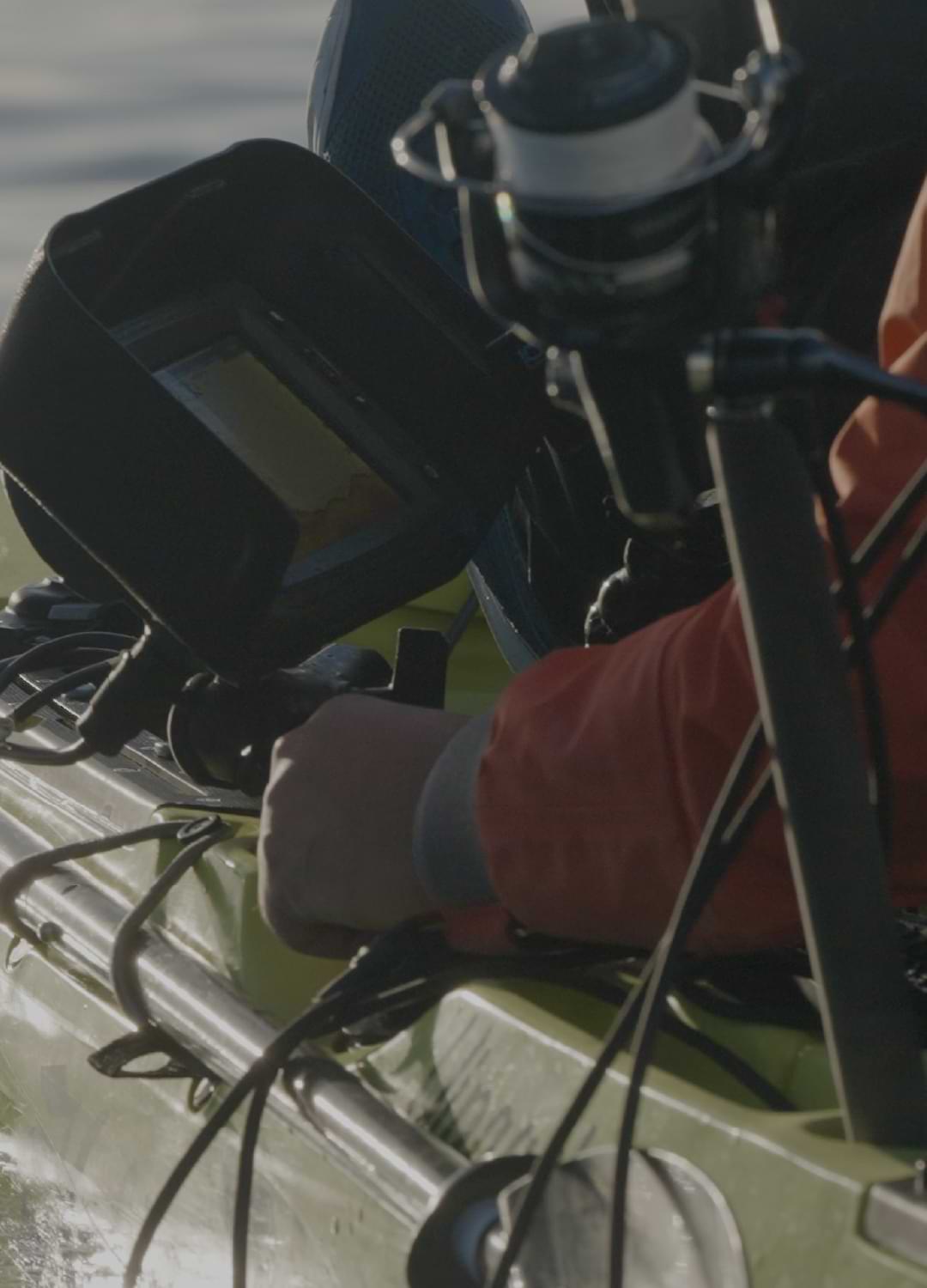 Paddling through the water, this angler's on a mission. Equipped with top-notch fishing gear and a high-tech mounted screen, they're not just cruising—they're locking onto their next big catch. With the kayak cutting smoothly through the waves, every paddle stroke brings them closer to that perfect fishing spot. The screen lights up with promise, marking where the action is beneath the surface. It's more than just fishing; it's precision angling at its finest!.